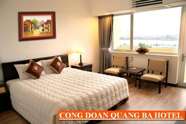 Postel nebo postele na pokoji v ubytování Khách sạn Công Đoàn Quảng Bá