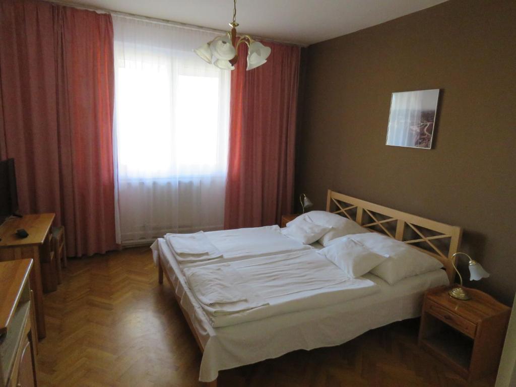 Postel nebo postele na pokoji v ubytování Thermál Apartmanház