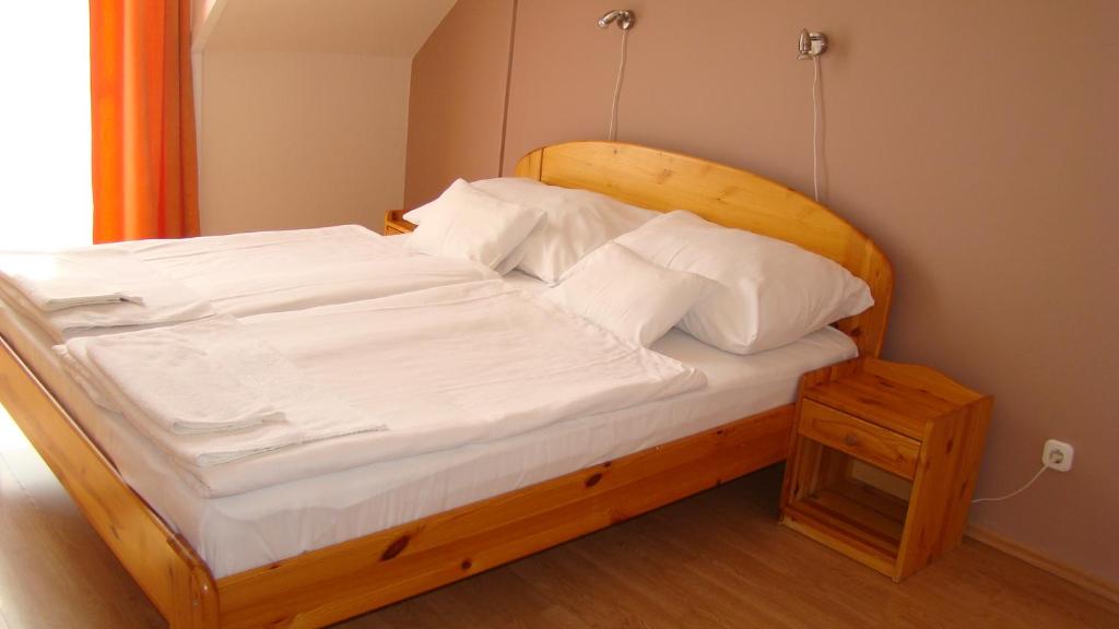 Postel nebo postele na pokoji v ubytování Thermál Apartmanház
