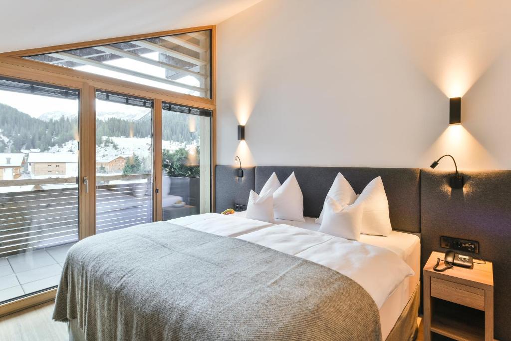 Postel nebo postele na pokoji v ubytování Hotel Sonnblick
