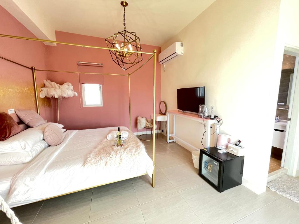 Postel nebo postele na pokoji v ubytování Pinky Promise Villa