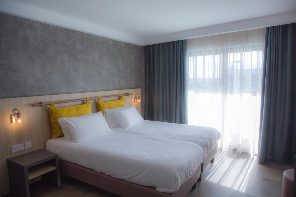 Postel nebo postele na pokoji v ubytování Ivy Hotel - Adults Only