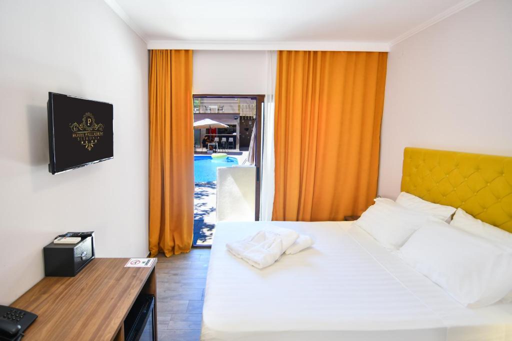 Postel nebo postele na pokoji v ubytování Hotel Palladium Sithonia
