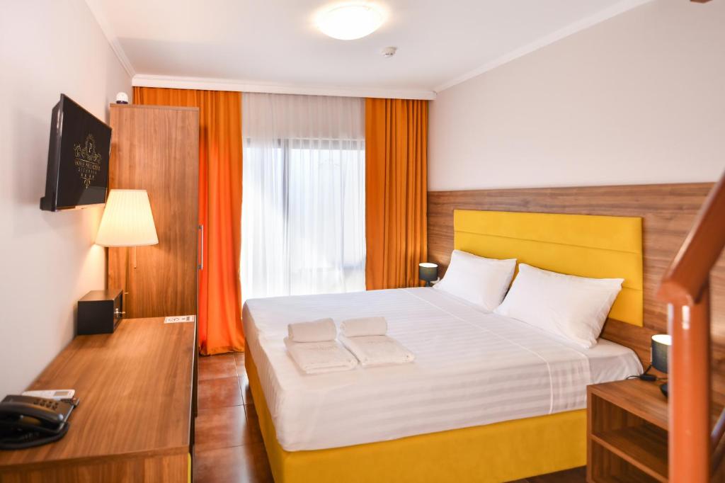 Postel nebo postele na pokoji v ubytování Hotel Palladium Sithonia