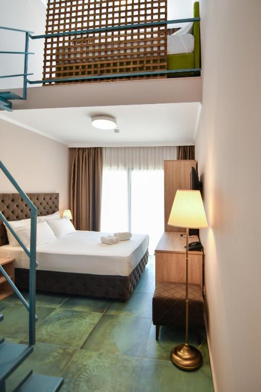 Postel nebo postele na pokoji v ubytování Hotel Palladium Sithonia