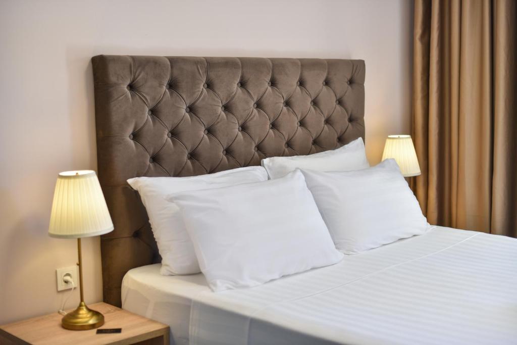 Postel nebo postele na pokoji v ubytování Hotel Palladium Sithonia