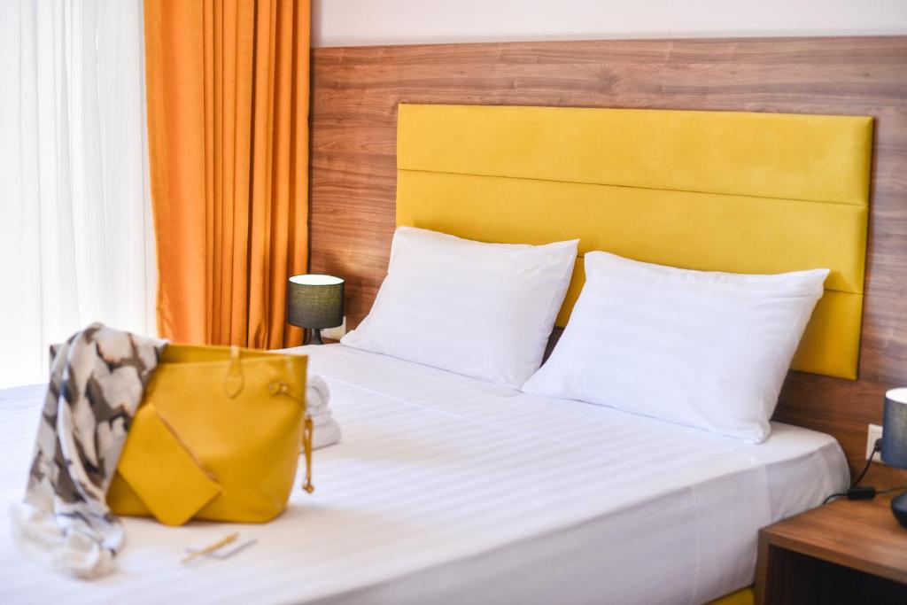Postel nebo postele na pokoji v ubytování Hotel Palladium Sithonia