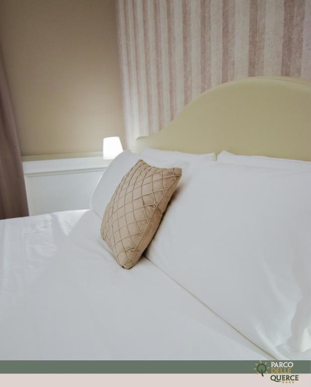 Postel nebo postele na pokoji v ubytování Hotel Parco delle Querce