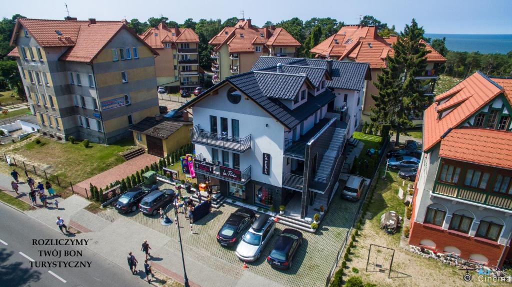 an overhead view of a town with cars parked in a parking lot at la perla in Krynica Morska