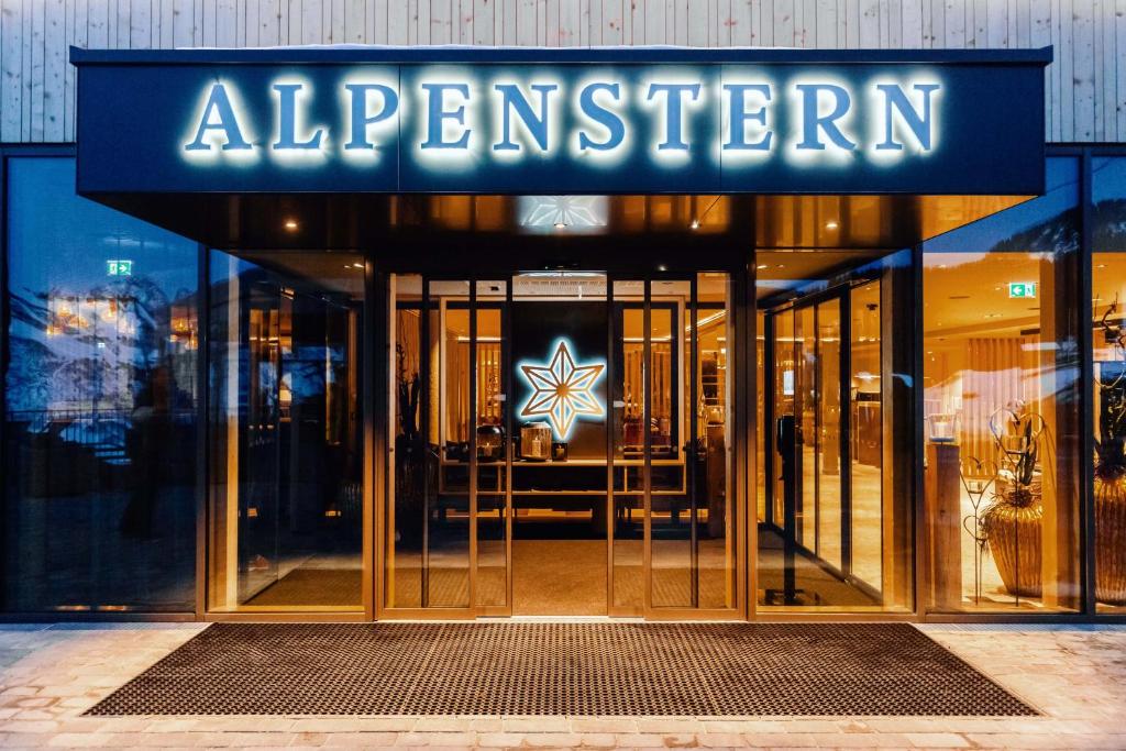 an entrance to a store with a sign on it at Hotel Alpenstern in Damuls