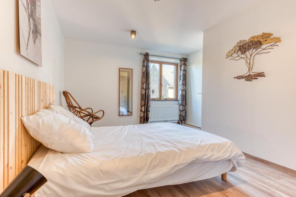 Postel nebo postele na pokoji v ubytování Gîte de la cascade