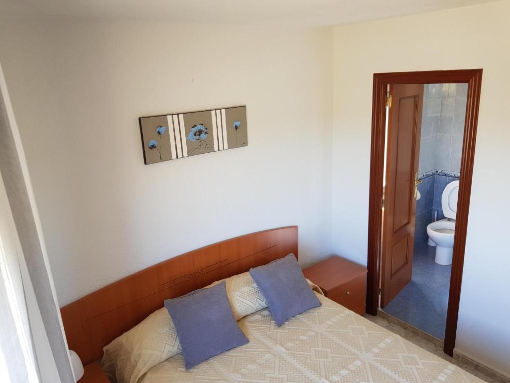 Posteľ alebo postele v izbe v ubytovaní Vivienda Turística El Asturiano