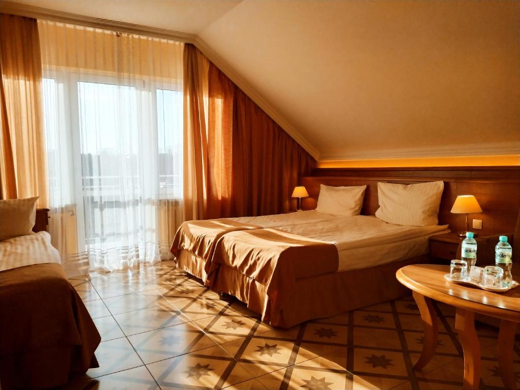 Postel nebo postele na pokoji v ubytování Hotel Polaris