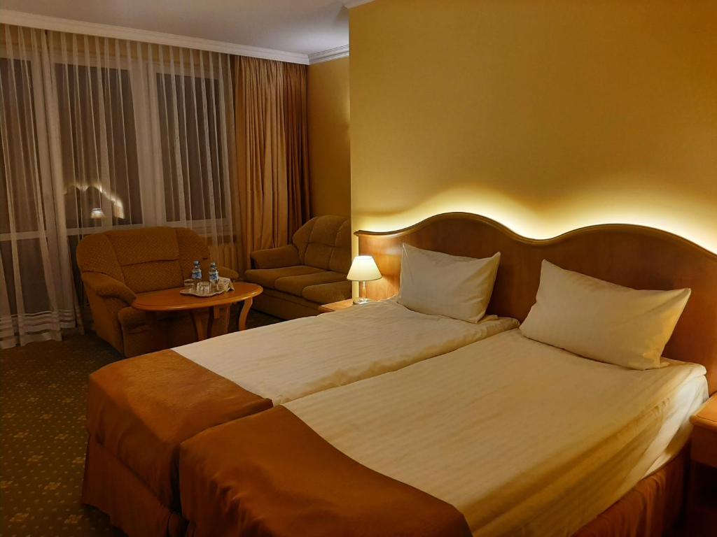 Postel nebo postele na pokoji v ubytování Hotel Polaris