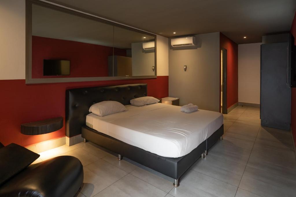 Postel nebo postele na pokoji v ubytování Residencial & Hotel Palazzo