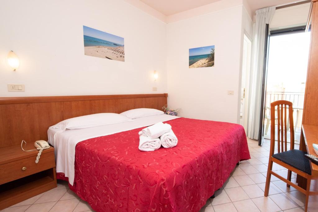 Postel nebo postele na pokoji v ubytování Hotel Acrux