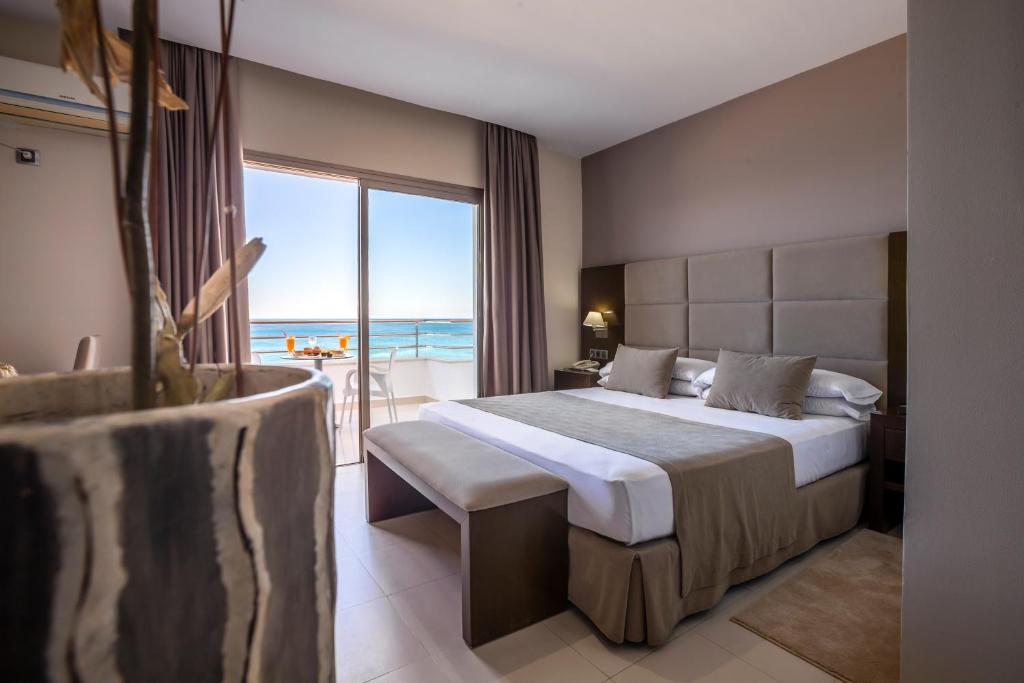 Postel nebo postele na pokoji v ubytování Hotel Omeya