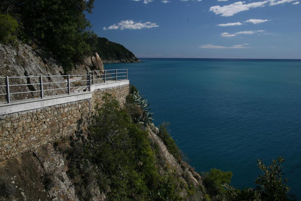 a view of the ocean from the side of a cliff at Grand Hotel Dei Castelli in Sestri Levante
