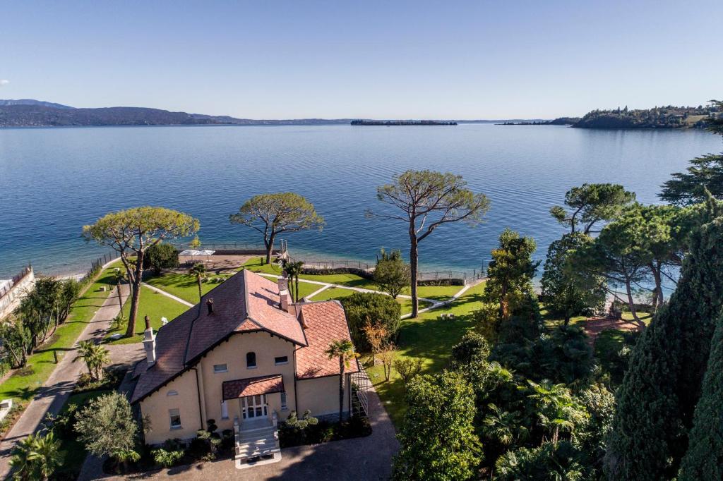 an aerial view of a house on the shore of a lake at Villa Belvedere in Salò