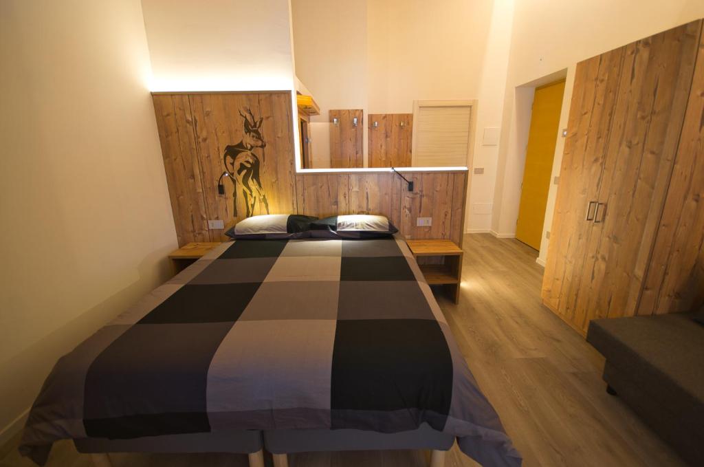 Posteľ alebo postele v izbe v ubytovaní B&B Paganella Relax and Gourmet