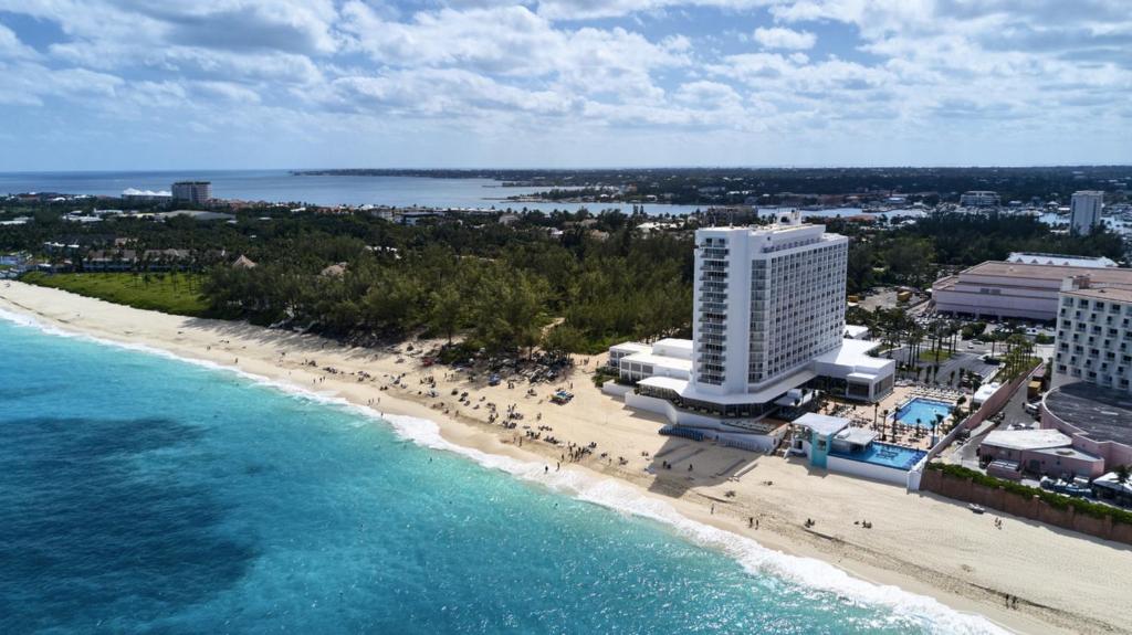 an aerial view of a beach and buildings and the ocean at Riu Palace Paradise Island - Adults Only - All Inclusive in Nassau