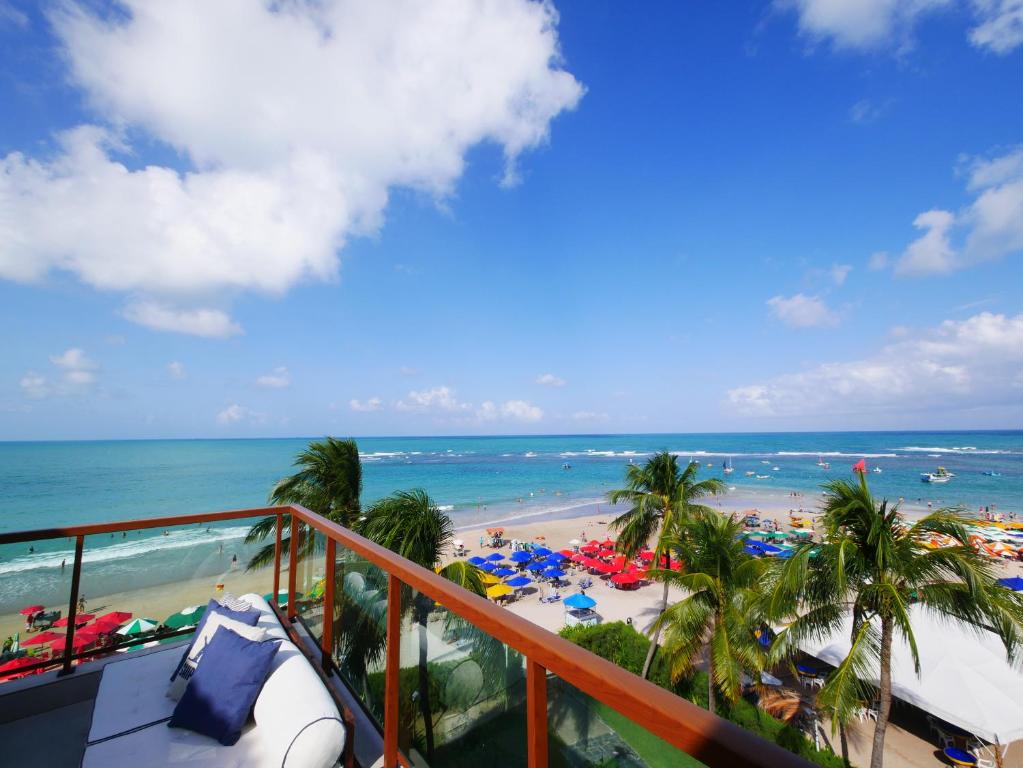 a view of the beach from a balcony of a resort at Pousada Ecos Beach in Porto De Galinhas