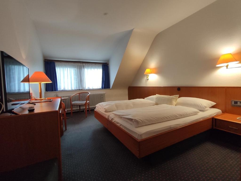 Postel nebo postele na pokoji v ubytování Condi Hotel