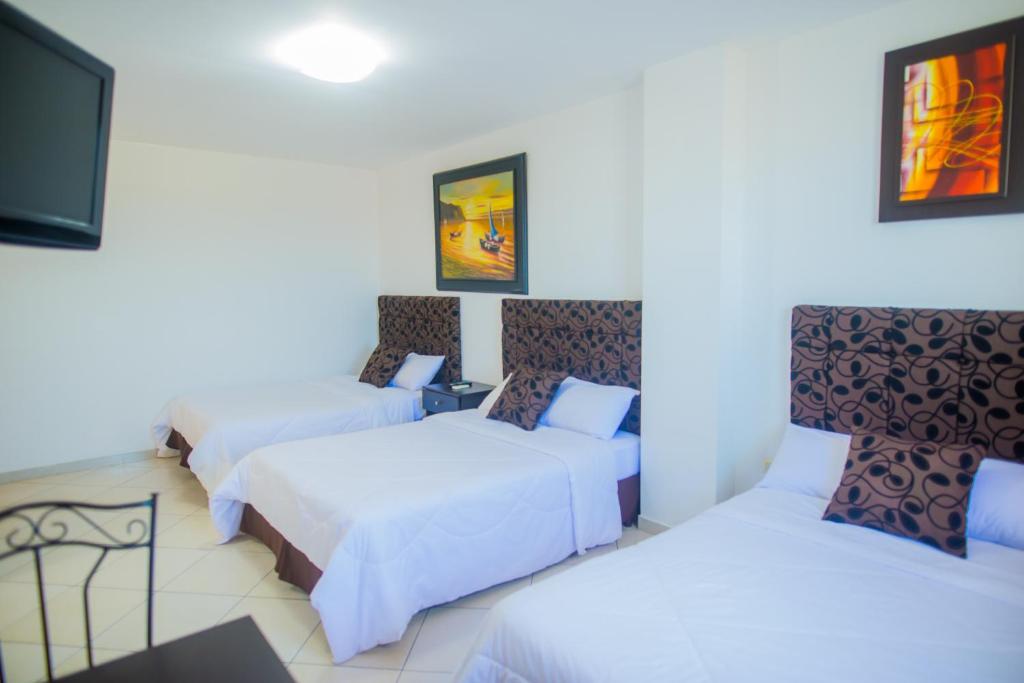Postel nebo postele na pokoji v ubytování Hotel Presidente Beach Salinas
