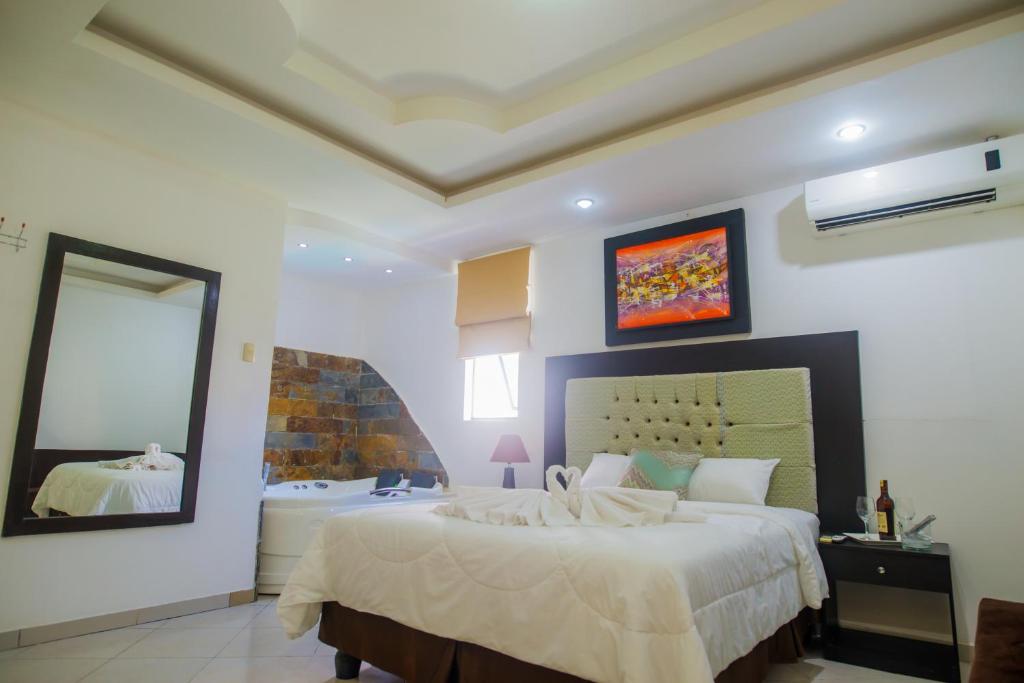 Postel nebo postele na pokoji v ubytování Hotel Presidente Beach Salinas