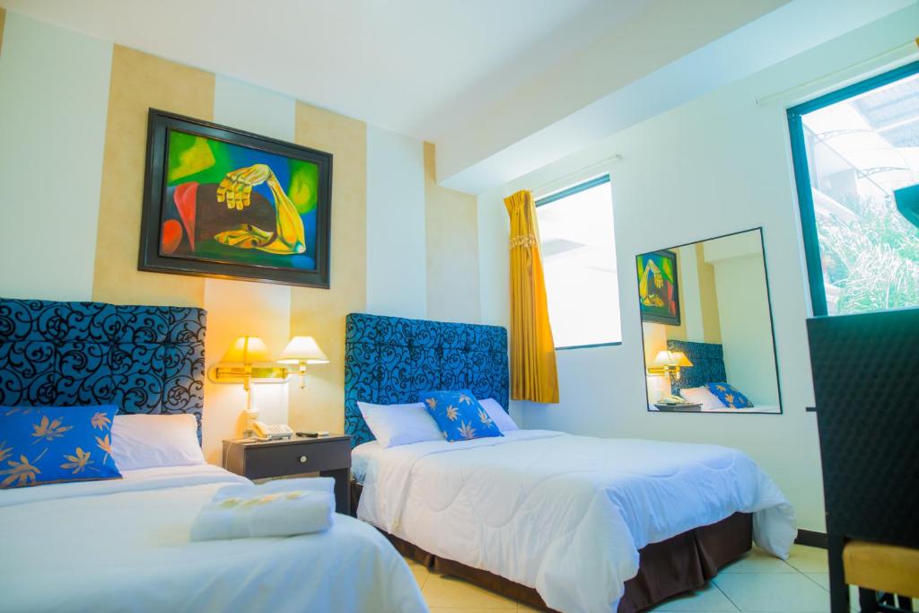 Postel nebo postele na pokoji v ubytování Hotel Presidente Beach Salinas