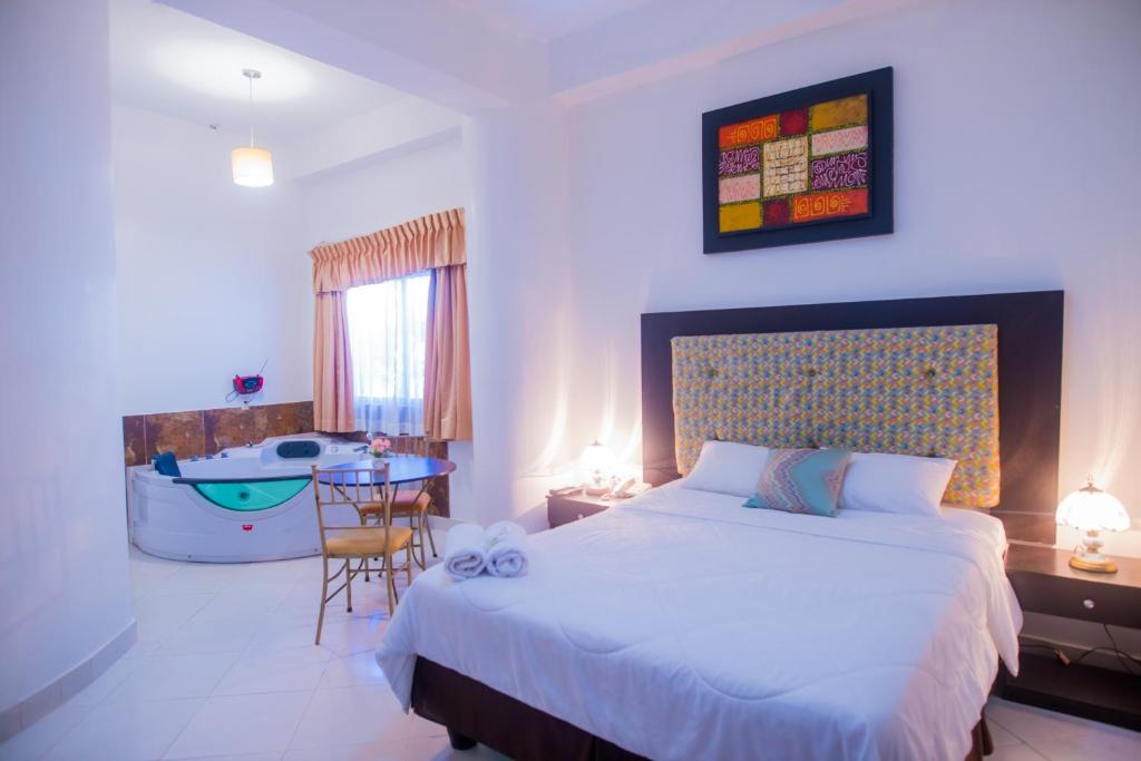 Postel nebo postele na pokoji v ubytování Hotel Presidente Beach Salinas