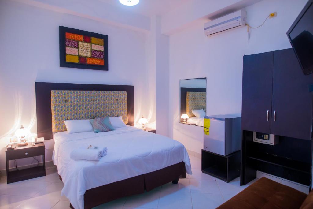Postel nebo postele na pokoji v ubytování Hotel Presidente Beach Salinas