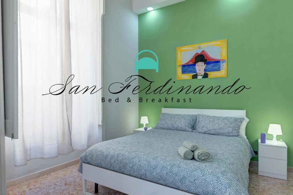- une chambre avec un lit et un panneau qui lit la confiture enchantée dans l'établissement B&B San Ferdinando Napoli, à Naples