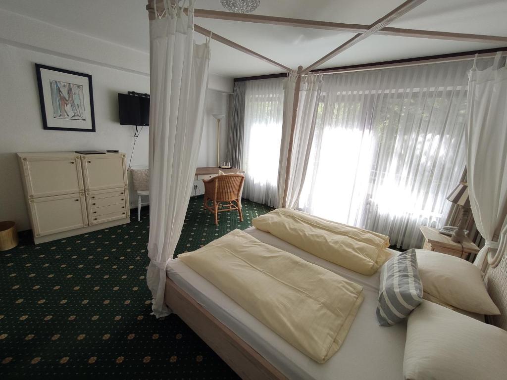 Postel nebo postele na pokoji v ubytování Condi Hotel