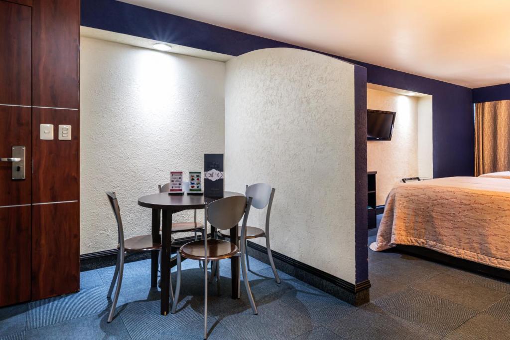 Postel nebo postele na pokoji v ubytování Hotel Parque Satelite