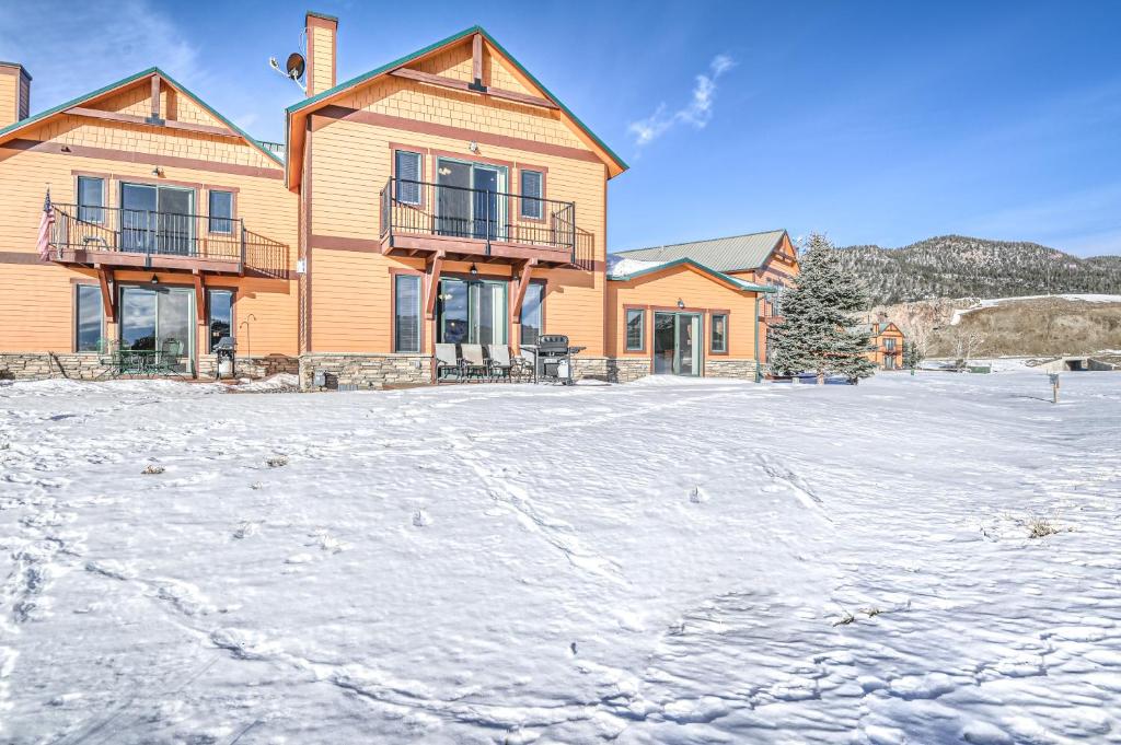 a house with snow in front of it at Rio Grand Golf Course Home in South Fork