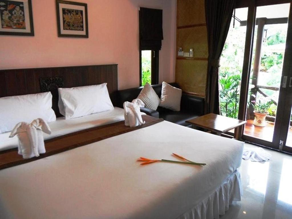 Postel nebo postele na pokoji v ubytování Seabreeze Hotel Kohchang