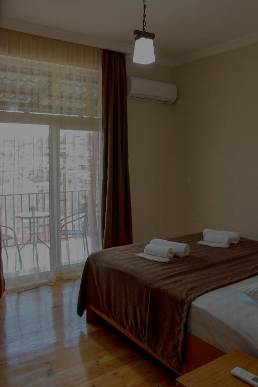 Llit o llits en una habitació de Guest House Maradona