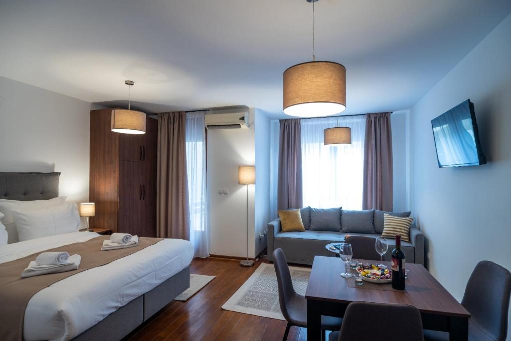 Ένα ή περισσότερα κρεβάτια σε δωμάτιο στο Apartman EROS