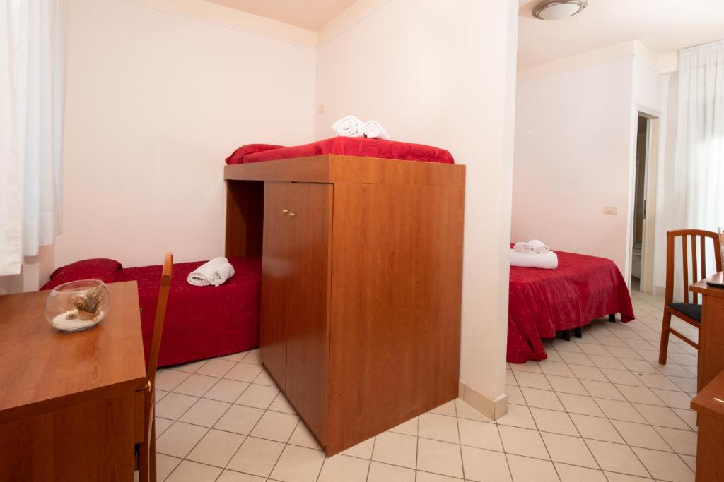 Postel nebo postele na pokoji v ubytování Hotel Acrux