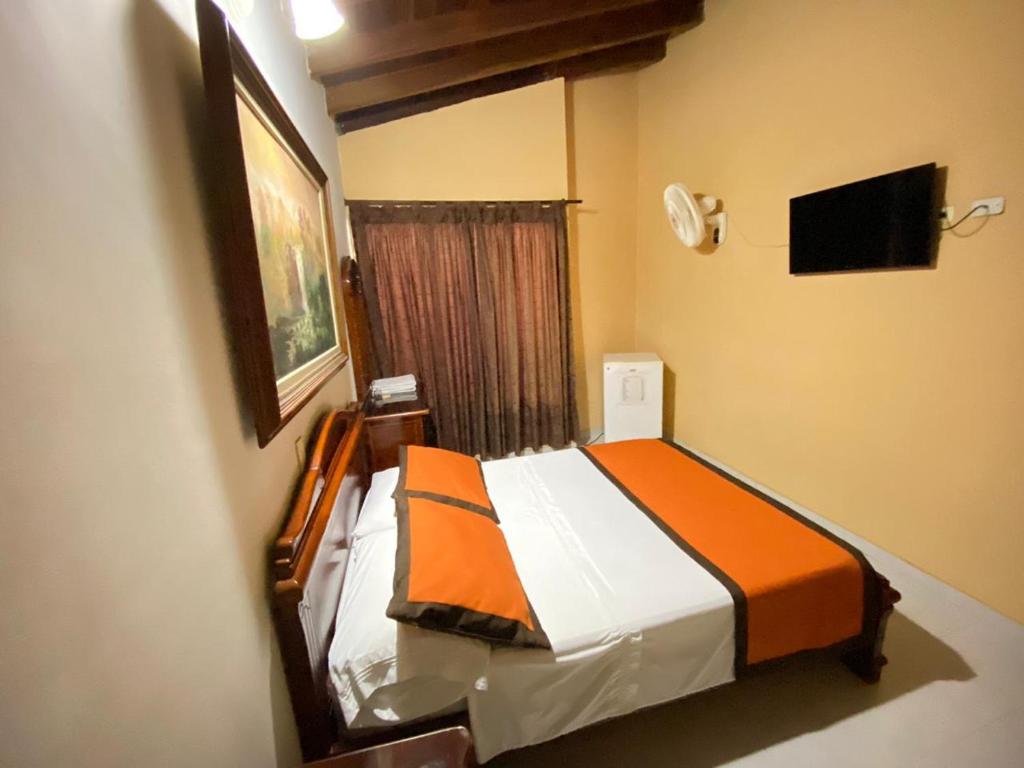 Postel nebo postele na pokoji v ubytování Hotel Tequendama