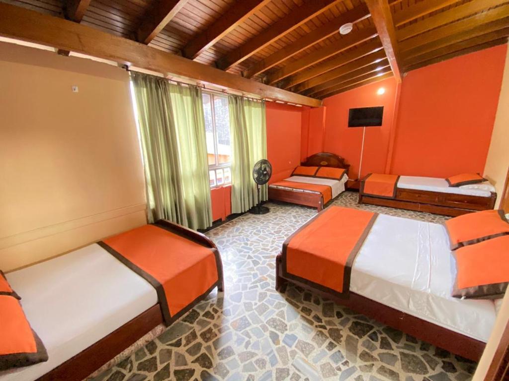 Postel nebo postele na pokoji v ubytování Hotel Tequendama