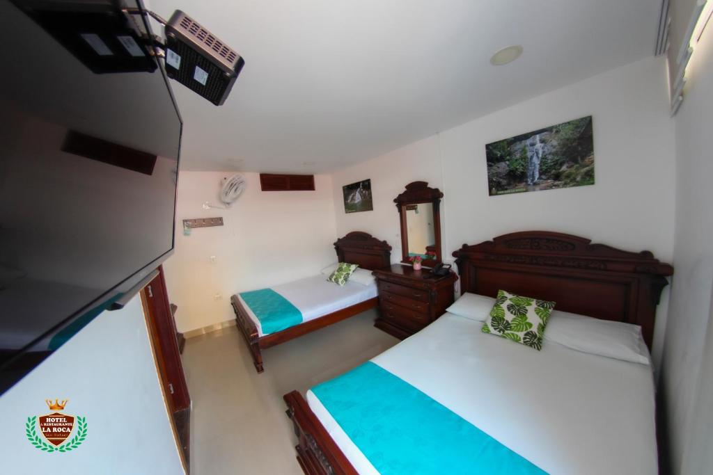 Postel nebo postele na pokoji v ubytování Hotel La Roca San Rafael