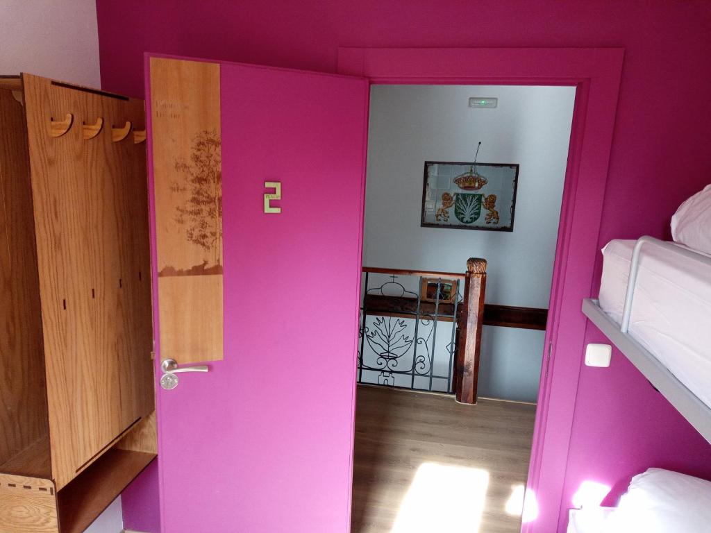A bed or beds in a room at Albergue Fresno de Cantespino - La Tormenta