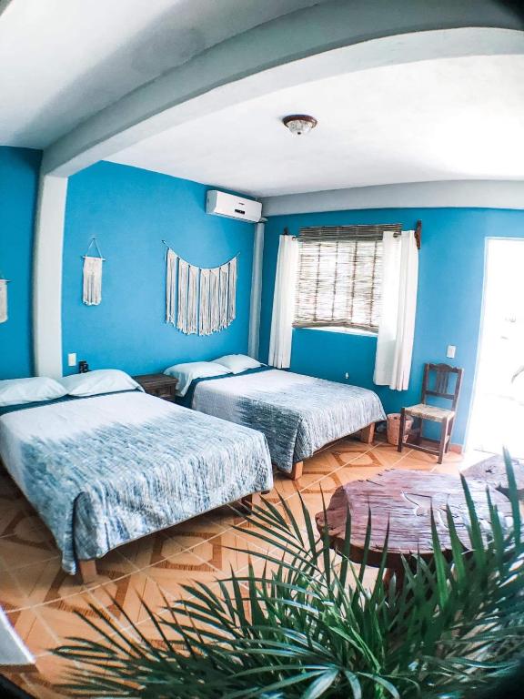 Postel nebo postele na pokoji v ubytování Colibri Hotel