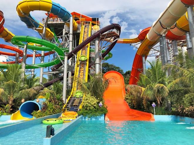 a water theme park with a water slide at Apartamento Resort em Olímpia in Olímpia