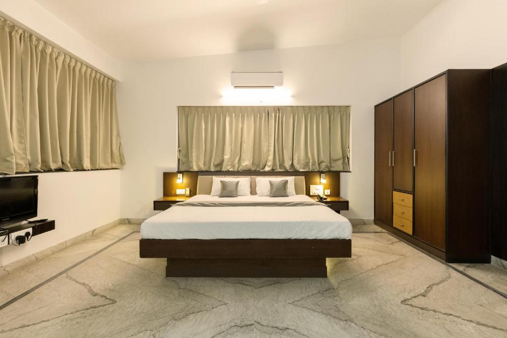 Ένα ή περισσότερα κρεβάτια σε δωμάτιο στο Hotel Paramount Suites & Service Apartments