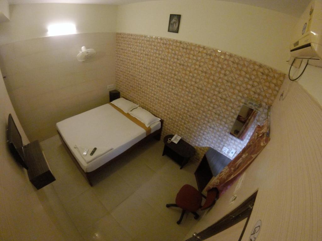 Postel nebo postele na pokoji v ubytování Just Guest House, Chennai Airport