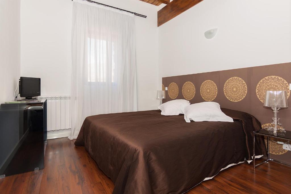 Postel nebo postele na pokoji v ubytování El Palacete del Obispo