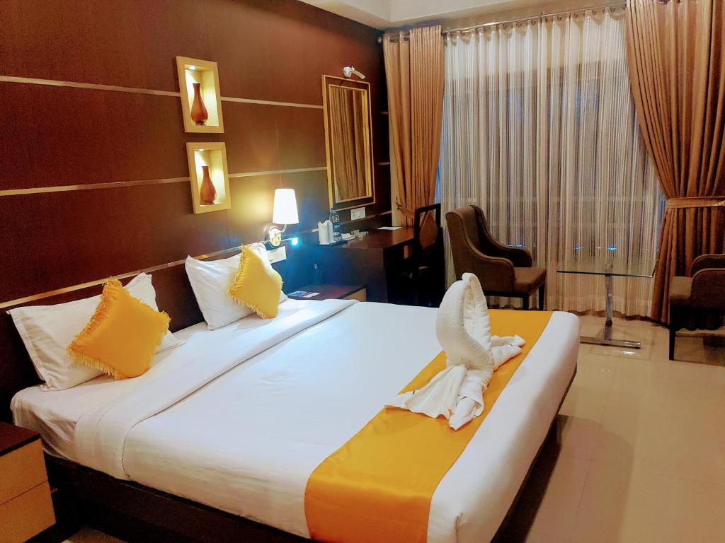 Postel nebo postele na pokoji v ubytování Hotel Virad